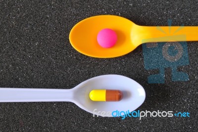 Spoonful Of Pills Stock Photo