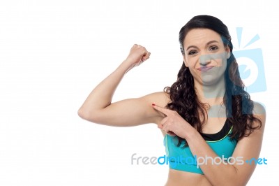 Sporty Woman Showing  Her Biceps Stock Photo