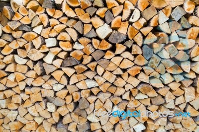 Stack Of Firewood As Tree Trunks Stock Photo