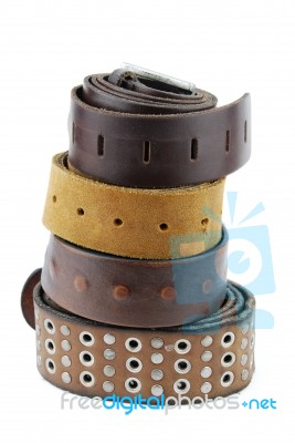 Stack Pile Of Leather Belts On White Stock Photo
