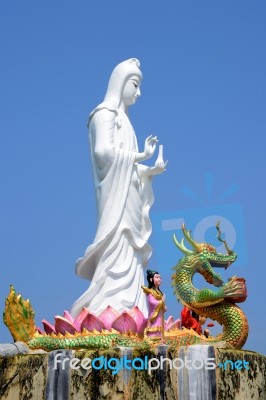 Standing Guanyin On Blue Sky Stock Photo