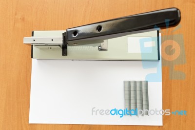 Stapler And Staples With Paper On The Table, Selective Focus Stock Photo