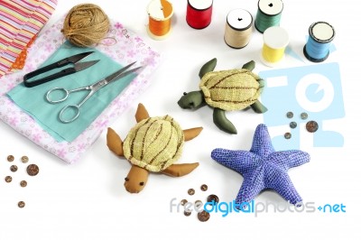 Starfish, Turtle Doll Made Of Cloth Stock Photo