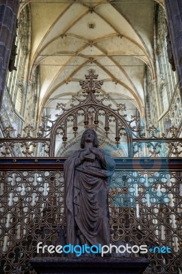 Statue Of A Woman Holding A Book In St Vitus Cathedral In Prague… Stock Photo