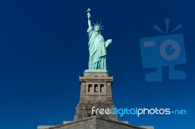Statue Of Liberty On Clear Blue Sky Stock Photo