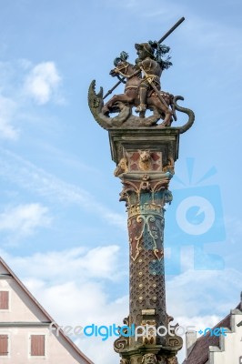 Statue On Top Of St. George's Fountain In Rothenburg Ob Der Taub… Stock Photo