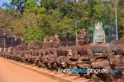 Statues Of Ancient Khmer Warrior Heads Carry Giant Snake Decorat… Stock Photo