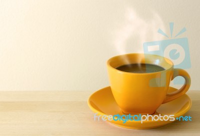 Steaming Coffee Cup On Table Stock Photo