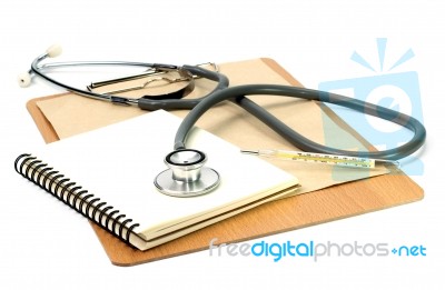 Stethoscope And Book On Board Stock Photo