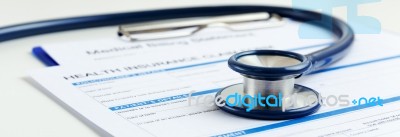 Stethoscope With Health Insurance Stock Photo