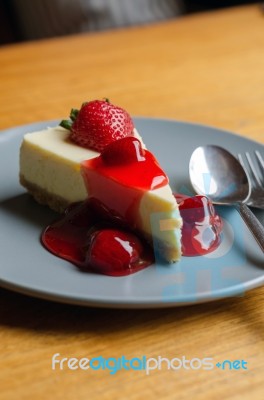 Strawberry Cheesecake With Spoon And Fork Stock Photo