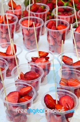 Strawberry in glass With Stick Stock Photo