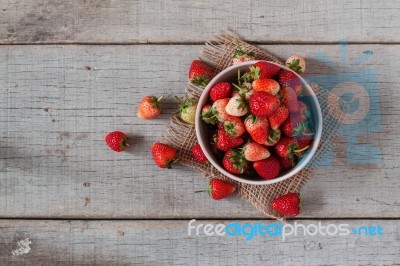 Strawberry On A Wooden Stock Photo