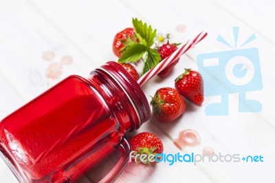 Strawberry Smoothie In Mason Jar With Straw Stock Photo