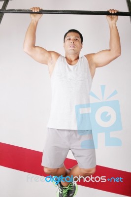 Strong Man Doing Pull Ups On Bar Stock Photo
