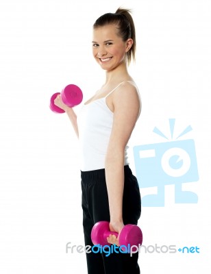 Strong Teenager Working Out With Dumbbells Stock Photo