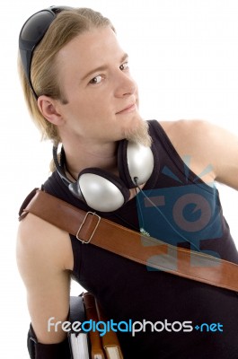 Student With Books And Headphone Stock Photo