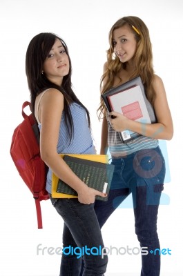 Students Holding Bag And Books Stock Photo