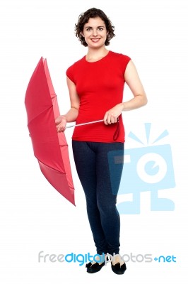 Stylish Young Woman With An Umbrella In Hand Stock Photo