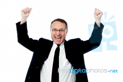 Successful Businessman Raising His Arms Stock Photo