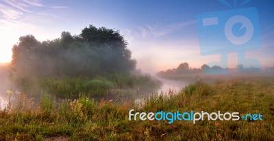 Summer Misty Sunrise On The River. Foggy River In The Morning. P… Stock Photo