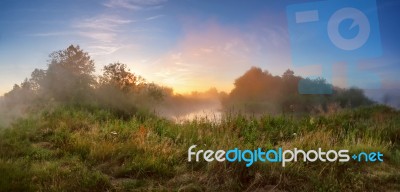 Summer Misty Sunrise On The River. Foggy River In The Morning. P… Stock Photo