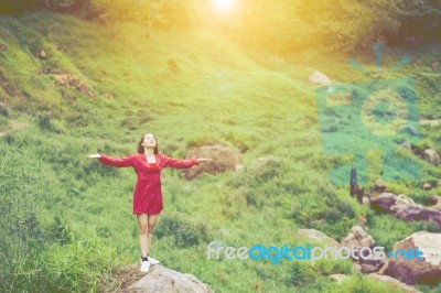 Summer Portrait Of Young  Women Enjoying Nature  In Tight Fitting Red Dress Summer Vacation,sunny,having Fun, Positive Mood,romantic, Against Background Of Summer Green Park, Green Leaves Stay Outdoor Stock Photo