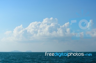 Summer Seascape With Green Island And Blue Sky Background Stock Photo