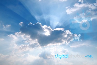 Sunbeam  Through The Haze On Blue Sky Stock Photo