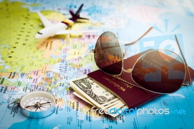 Sunglasses, Passport, Money, Compass And Aircraft On The World M… Stock Photo