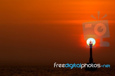 Sunset Behind The Lighthouse Stock Photo