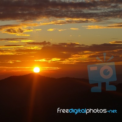 Sunset Cloudy Sky Stock Photo