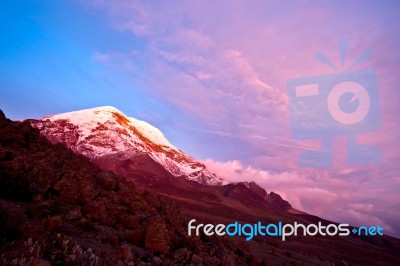 Sunset On The Mighty Chimborazo Volcano. Ecuador's Highest Summi… Stock Photo