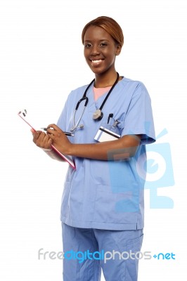 Surgeon Writing on clipboard Stock Photo