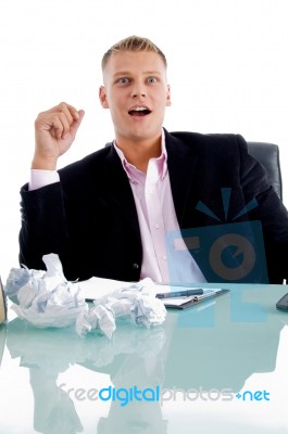 Surprised Businessman at desk Stock Photo