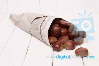Sweet Chestnuts Wrapped In Newspaper Stock Photo