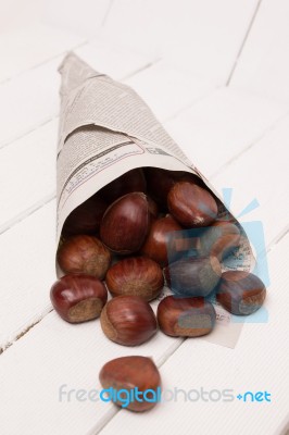 Sweet Chestnuts Wrapped In Newspaper Stock Photo