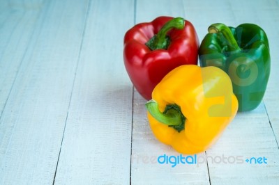 Sweet Pepper On Wooden Background Stock Photo