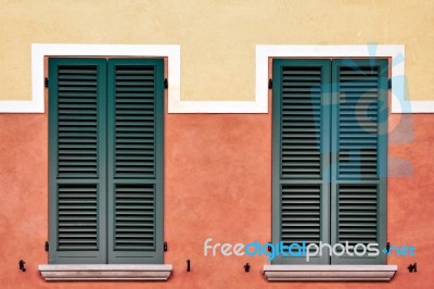 Symmetrical Shutters On A Building In Desenzano Del Garda Stock Photo