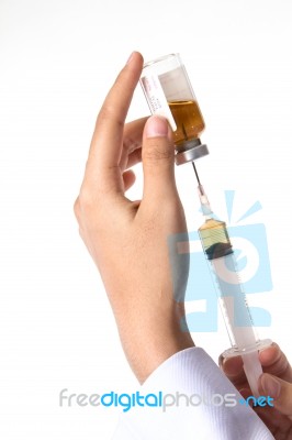 Syringe And Nurse's Hand Stock Photo