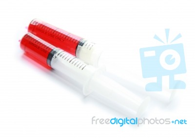Syringe With Red Liquid Isolated On White Background Stock Photo