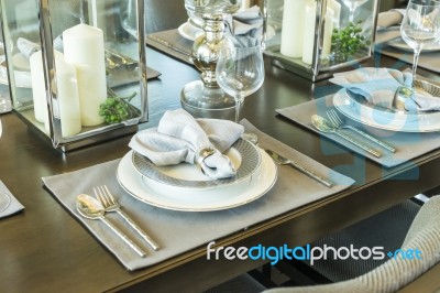 Table Set On Wood Dinning Table At Home Stock Photo