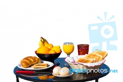 Table With Food As Breakfast On White Background Stock Photo