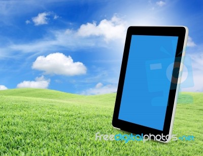 Tablet Pc On Green Grass Stock Photo