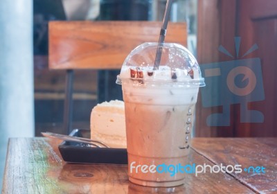 Take-home Ice Coffee Cup On Wooden Table Stock Photo