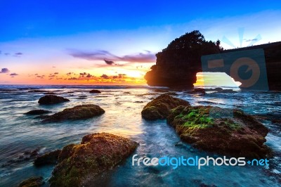 Tanah Lot Temple At Sunset In Bali, Indonesia.(dark) Stock Photo