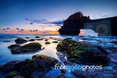 Tanah Lot Temple At Sunset In Bali, Indonesia.(dark)seascape Stock Photo