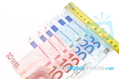 Tape Measure And Euro Bills Concept Of Financial Crisis Stock Photo