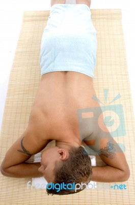 Tattooed Guy Resting In Spa Salon Stock Photo