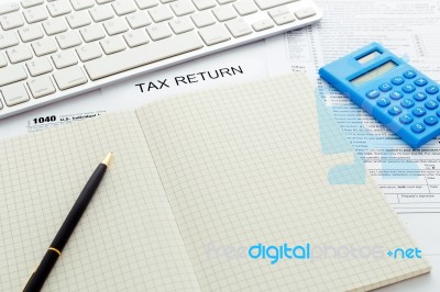 Tax Concept With Pen And Notebook Stock Photo